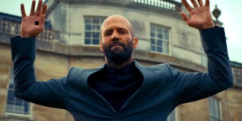 Jason-statham-as-adam-clay-putting-his-hands-up-in-the-beekeeper