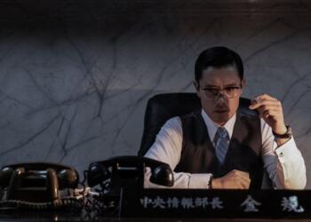 The Man Standing Next